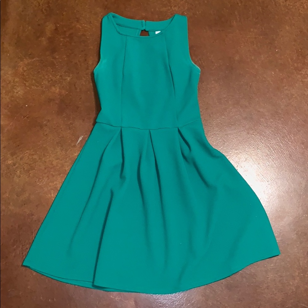 Cute green dress with the cut out back.